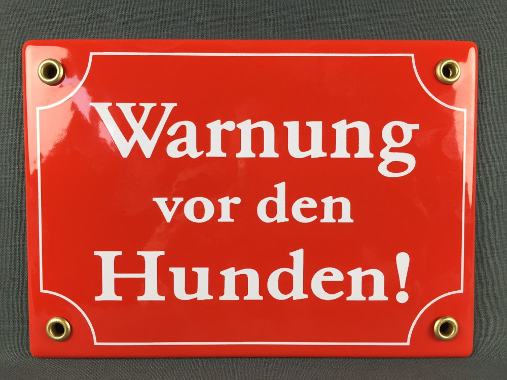 Hinweis Schild Warnung vor den HUNDEN rot